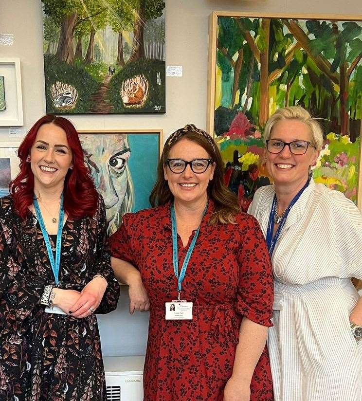 Creative Communities Identities: Sarah Hemmings (Creative Communities), Tanya Reid (Creative Communities) and Helen Saxton from Arlington Arts who are hosting the exhibition, in front of their own artworks.