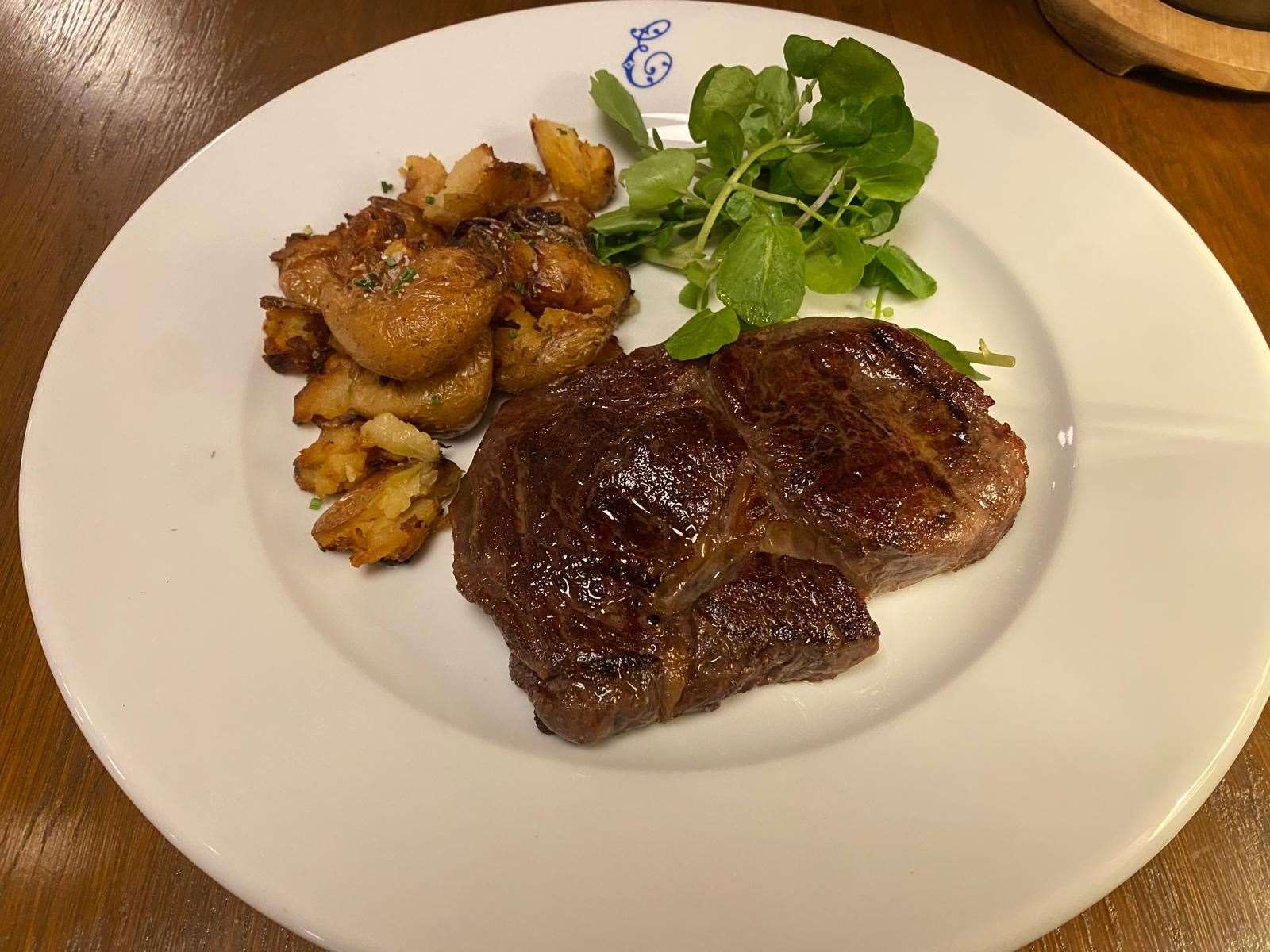 Hampshire 32-day dry aged ribeye served with potatoes (£32)