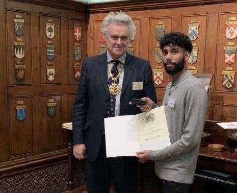 Jesal Ravel receiving his award from Dr Bowdler