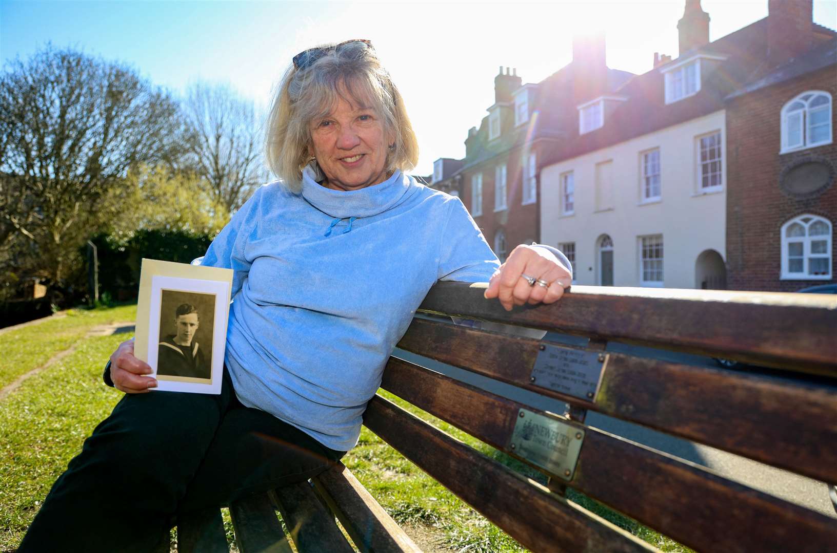Carol Brindley sitting on the memorial bench dedicated to her father Eddie Jones in West Mills