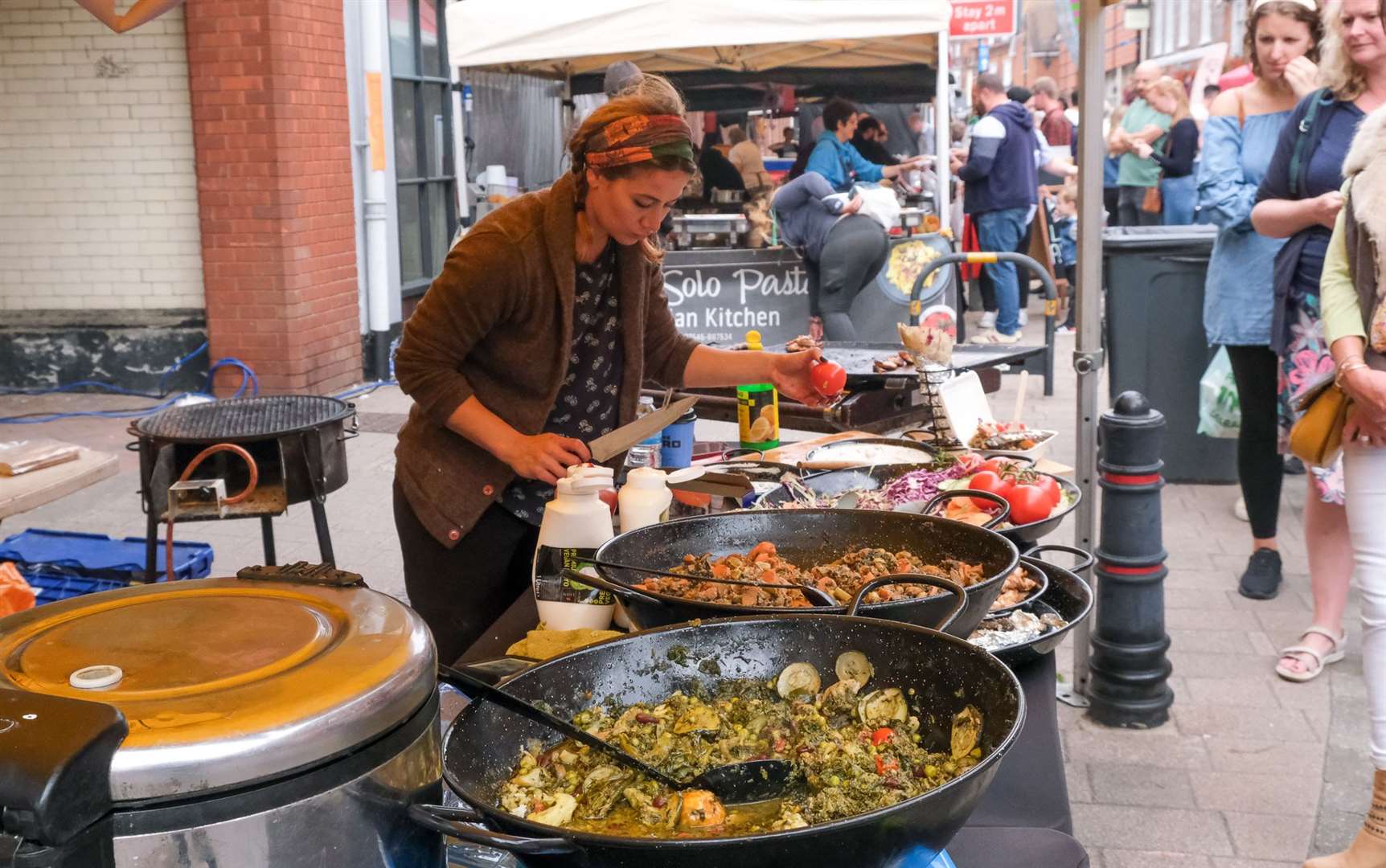 A seller prepares food.