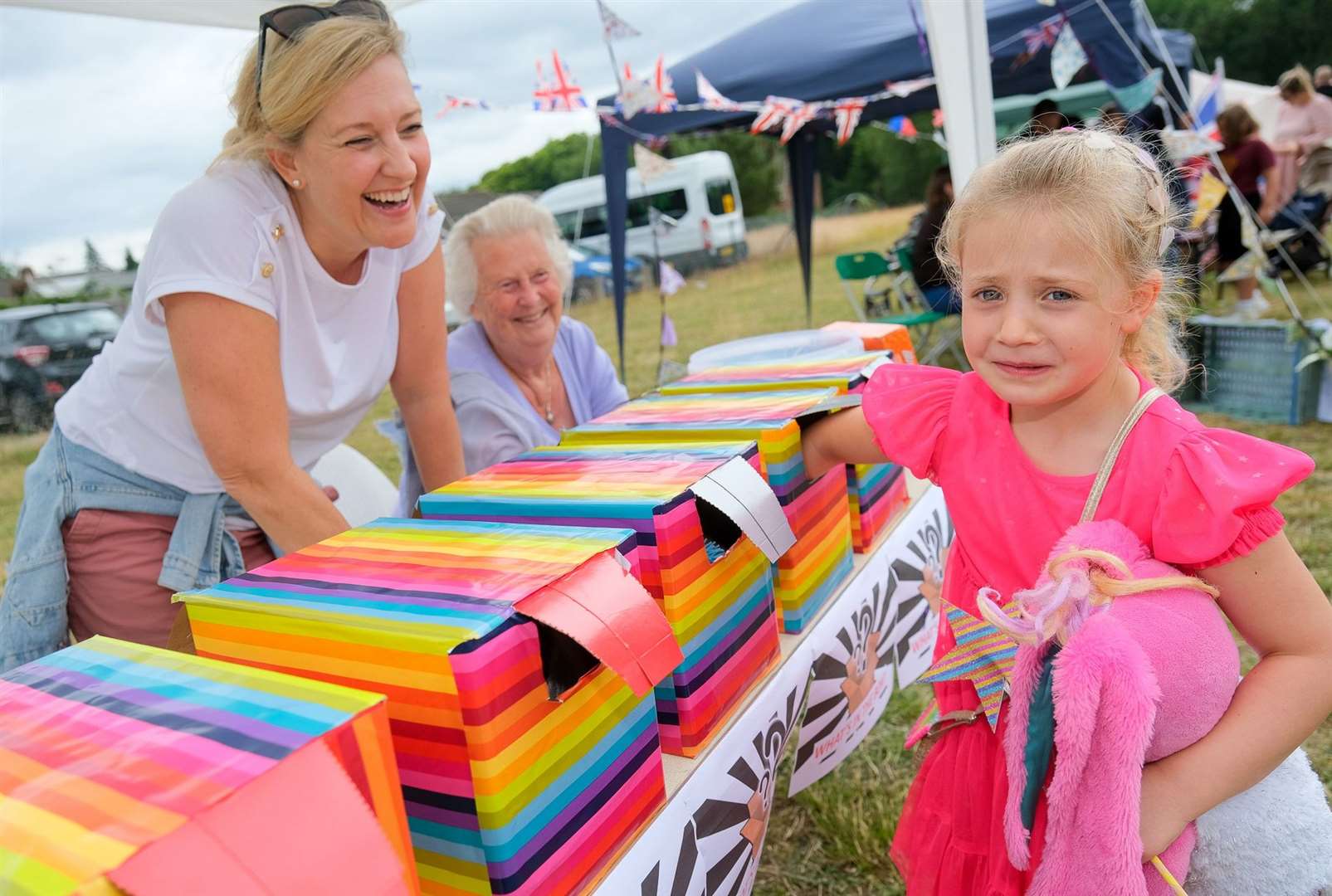 Andrea Vardy, Ottie Fielding, age five, and Kay Vardy play ‘Guess What’s in The Box’