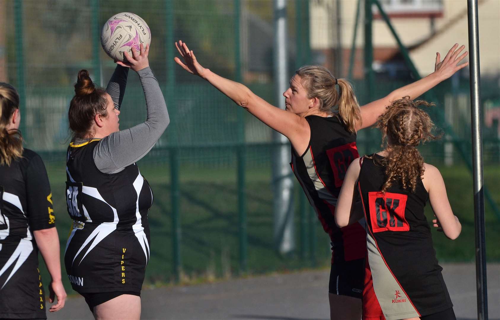 A Vipers player has control of the ball