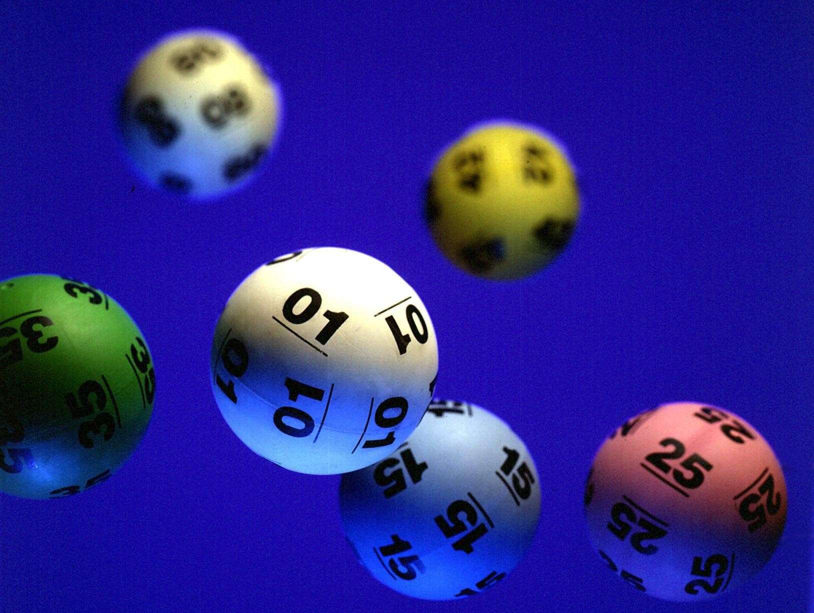 A mystery woman from Berkshire has won £10,000 a month for a year after matching five numbers in a National Lottery draw