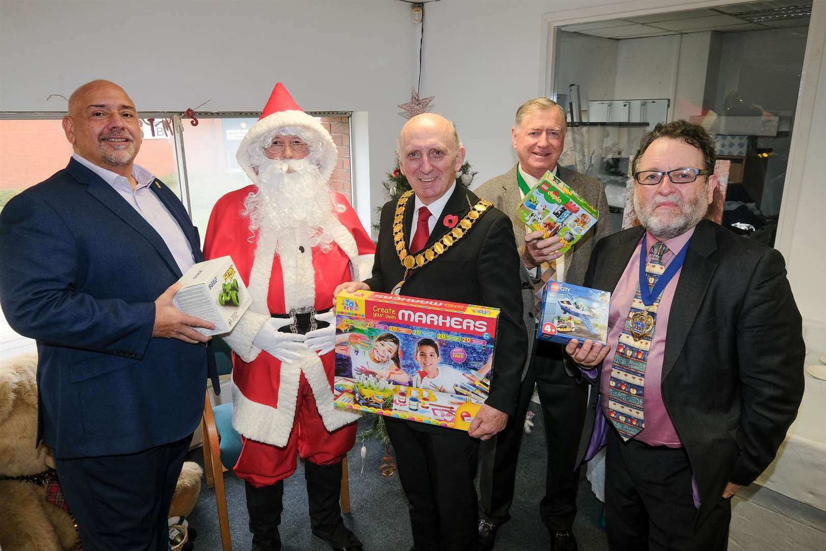 The Louise Purton Christmas Toy Appeal: Swift Group managing director Adrian Smith, Father Christmas, Thatcham Mayor Cllr John Boyd, West Berkshire deputy chairman Cllr Rick Jones, Deputy Mayor of Newbury Cllr Gary Norman Ref: 46-1721