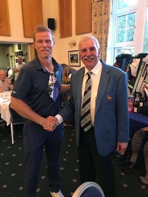 Guy Woodman receiving his prize from club captain Ken Kenyon