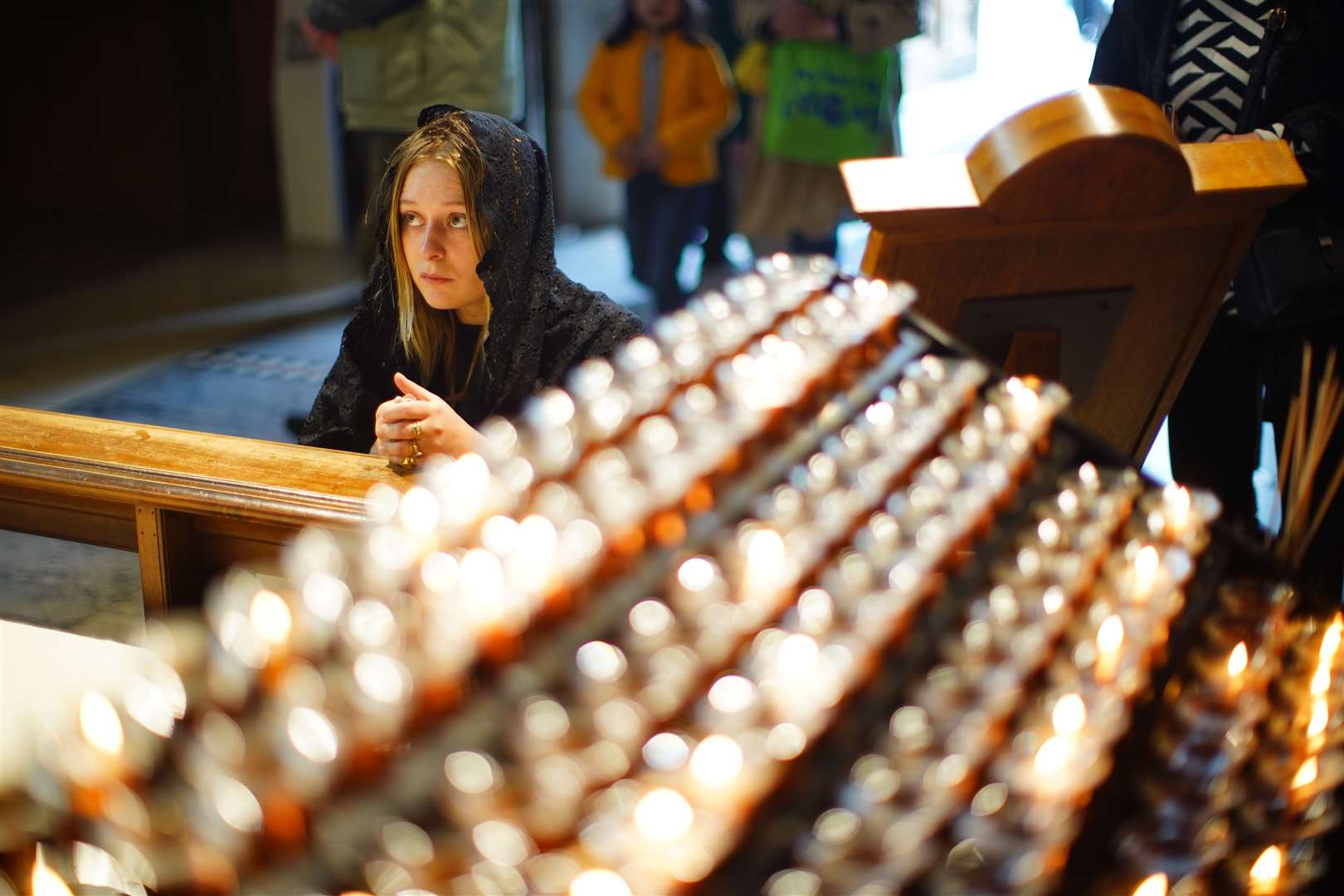 A woman kneels in Westminster Cathedral following the announcement of the death of Pope Francis (James Manning/PA Wire)