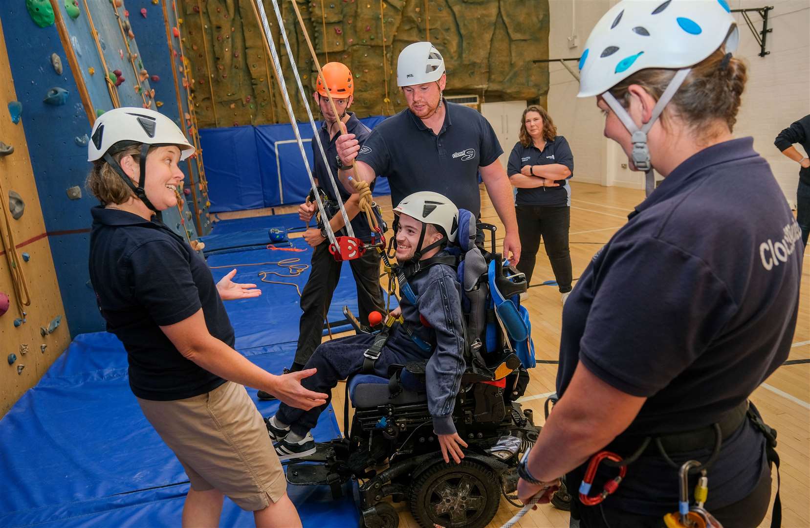Swings & Smiles using the climbing wall