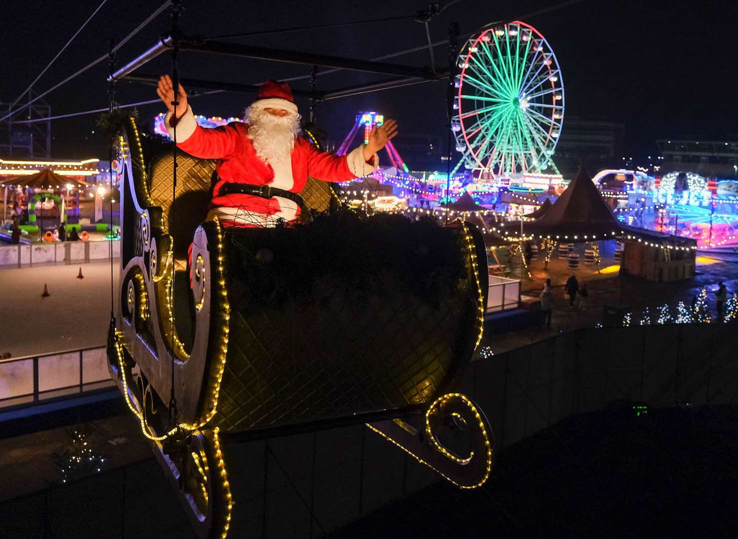 Santa took to the skies on the opening day of the Great Christmas Carnival at Newbury Racecourse
