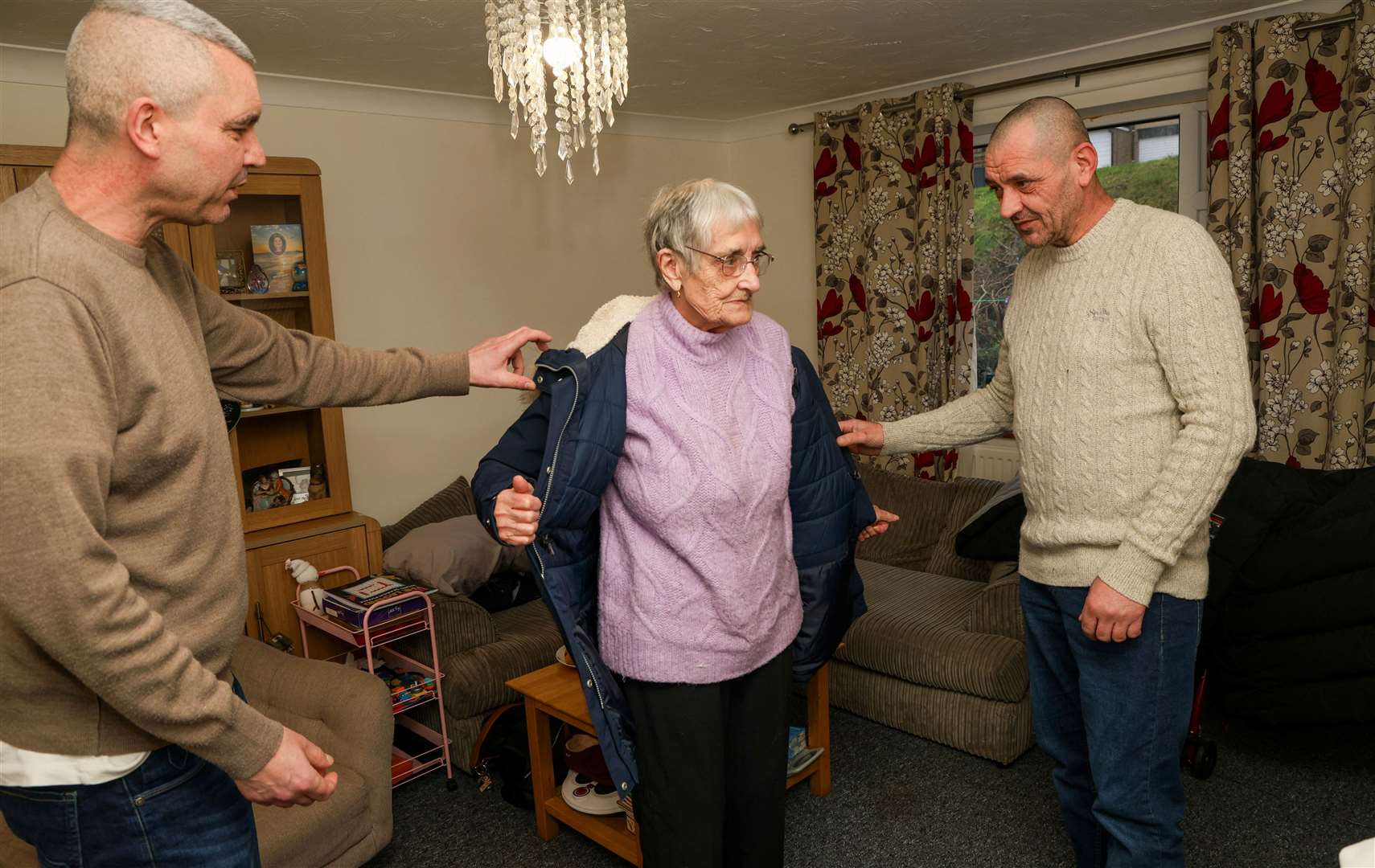 Carl and Tyrone help their mother Shirley Andrews to get ready to go to Greenfield House day centre in Calcote