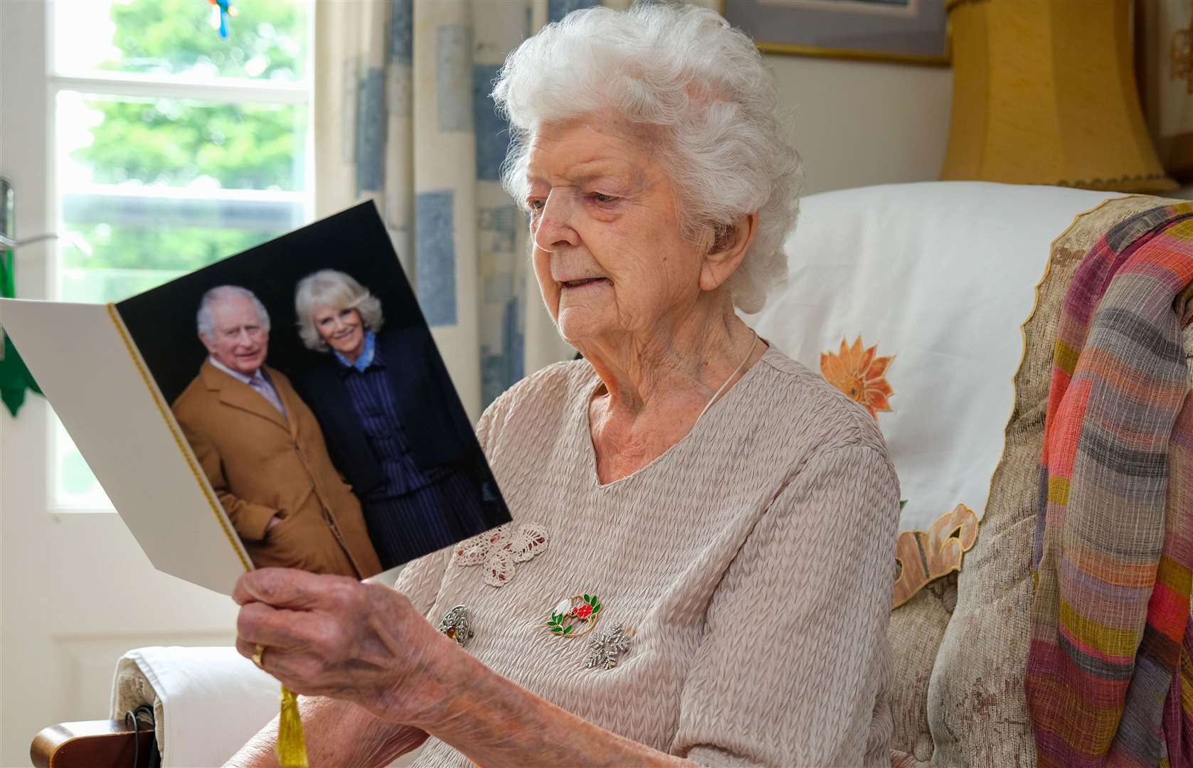 Mary Cholwill reading her card from the King