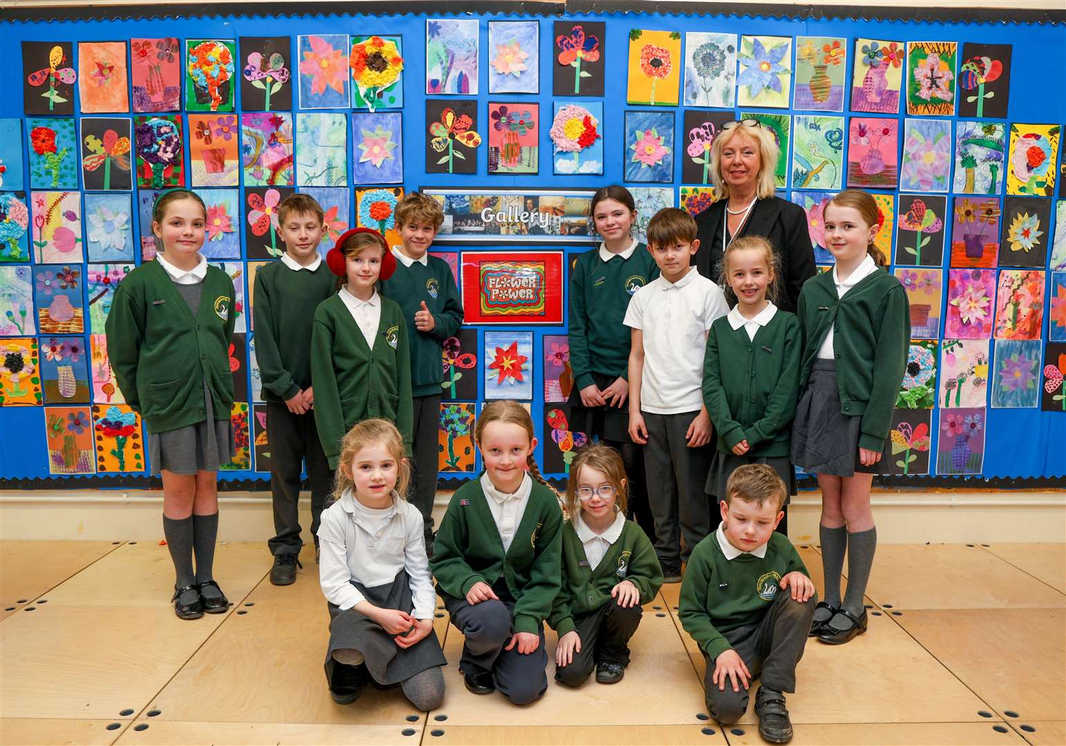 Headteacher Melissa Fry and pupils with their art display
